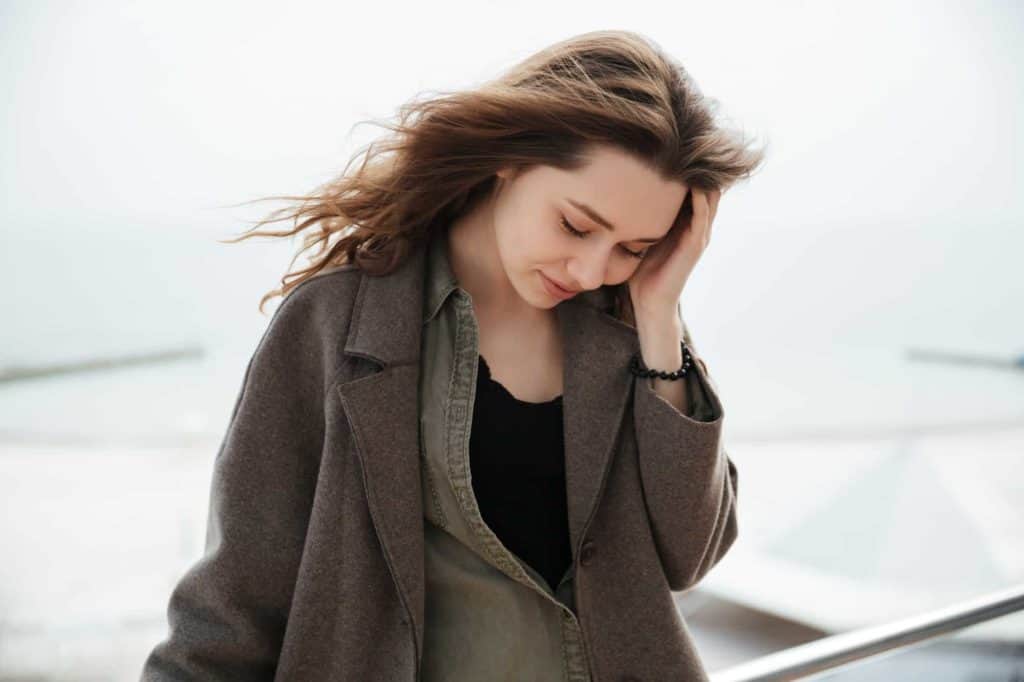 Tired woman near sea