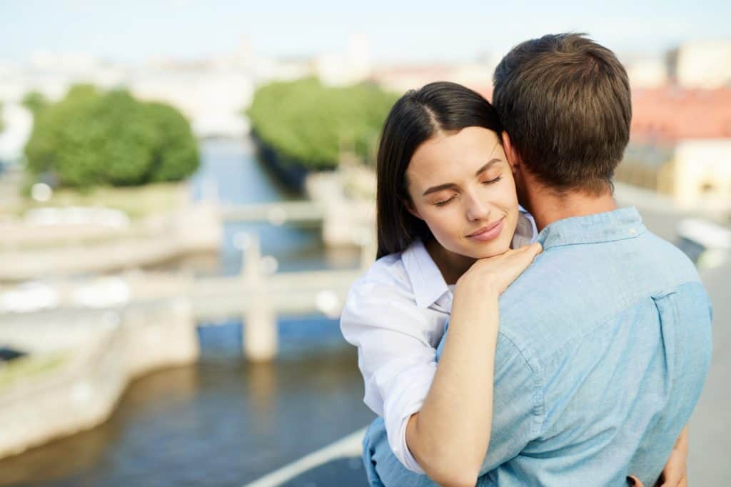 Calm lady with boyfriend on roof